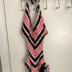 Surf side monokini swim suit white, neon orange, green and black.